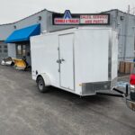 2025 AMERICAN HAULER ARROW DELUXE 6′ X 12′ WITH 6′ 6″ INTERIOR HEIGHT CARGO / ENCLOSED TRAILER